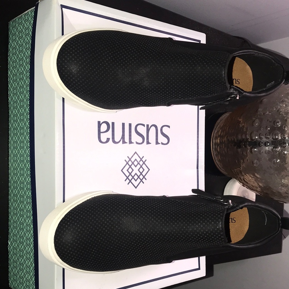 modern faux leather sneaker lifted on hidden wedge heel